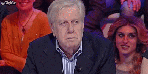 GIF reazione: uomo perplesso che scuote la testa, incerto
